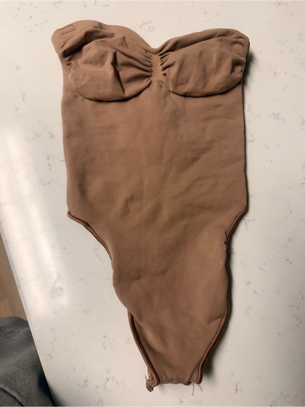 Skims One-Piece Bodysuit in Tan Brown